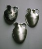 Cast silver vase brooches with different finishes